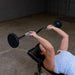 Body-Solid Fixed Curl Bars - Woman lifting barbell 