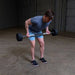Body-Solid Fixed Straight Bars - Man curl down position while holding a barbell 
