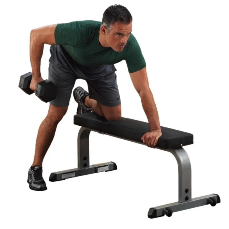 Body-Solid Flat Bench GFB350 - man  working out one leg on the bench and holing a dumbbell 