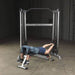 Body-Solid Functional Training Center GDCC200 - woman on training in bench press holding handle to pull weight stacks