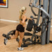 Body-Solid Fusion 600 Personal Trainer F600 - woman on training left leg on foot support