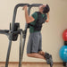 Body-Solid Fusion VKR Dip Pull Up Station FCD - Man on training chin up exercise