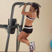 Body-Solid Fusion VKR Dip Pull Up Station FCD - woman on product while doing chin up excercise