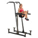 Body-Solid Fusion VKR Dip Pull Up Station FCD - Woman on product doing knee press