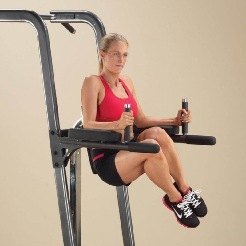 Body-Solid Fusion VKR Dip Pull Up Station FCD - woman photo on the product doing side ways knee press