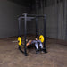 Body-Solid GPR400 Power Rack - woman totally laying down with a barbell on her chest 