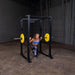 Body-Solid GPR400 Power Rack - Woman knee down while barbell is placed at her back