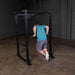 Body-Solid GPR400 Power Rack - Man working out in Dips