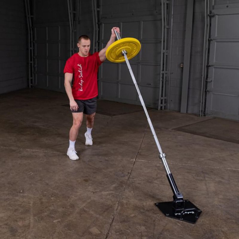 Body-Solid Home Plate T-Bar Row Landmine TBR50 - man working out holding a long rod with yellow weight plate