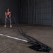 Body-Solid Home Plate T-Bar Row Landmine TBR50 - woman on training holding a black rope