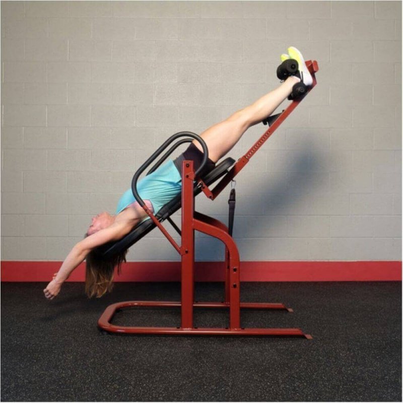 Body-Solid Inversion Table GINV50 - side view photo of the product and a woman in training