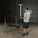 Body-Solid Lat Pull Low Row Attachment GLRA81 - Man working out in holding lat bars 