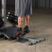 Body-Solid Leverage Squat Calf Machine GSCL360 - a man standing on a machine