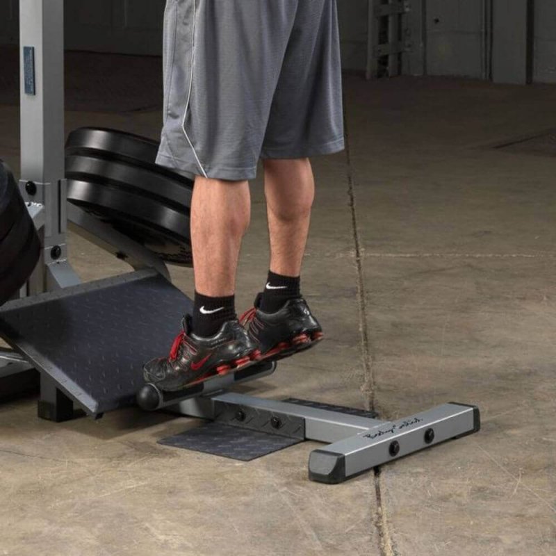 Body-Solid Leverage Squat Calf Machine GSCL360 - a man standing on a machine