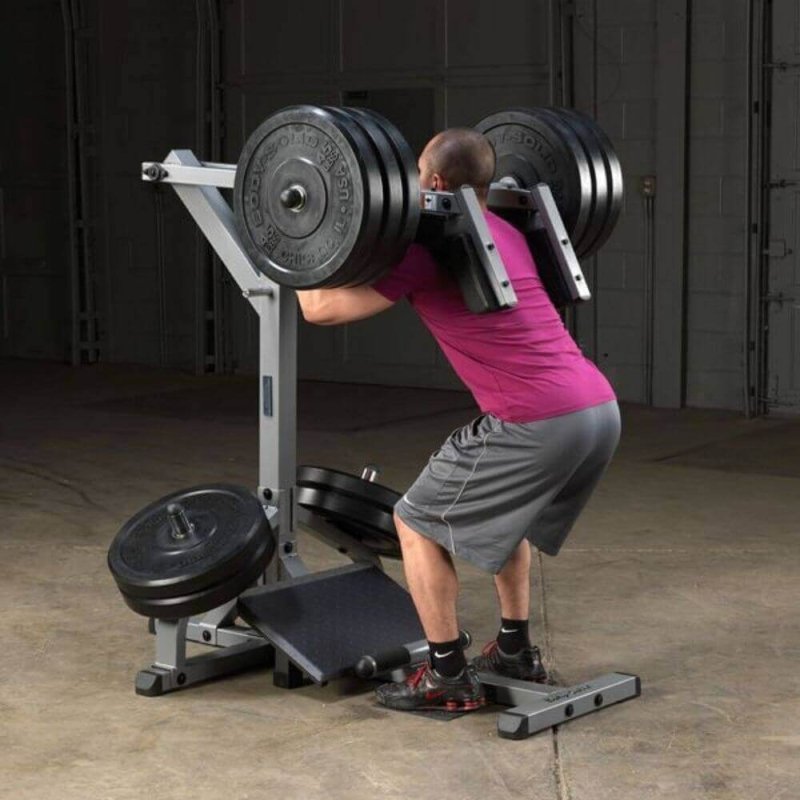 Body-Solid Leverage Squat Calf Machine GSCL360 - a man lifting weights on a weight machine