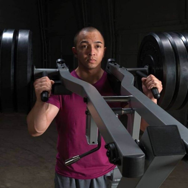 Body-Solid Leverage Squat Calf Machine GSCL360 - front view of a man lifting weights on a machine