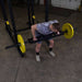 Body-Solid Multi Grip Olympic Bar OMG86 - Top view picture of man holding the bar weight plate