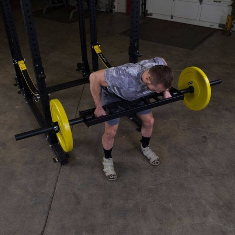 Body-Solid Multi Grip Olympic Bar OMG86 - Top view picture of man holding the bar weight plate