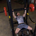 Body-Solid Multi Grip Olympic Bar OMG86 - Top view photo man laying down on bench pulling up a heavy barbell