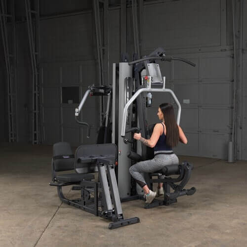 Body-Solid Multi-Stack Home Gym System G9S - woman sitting with Should workout