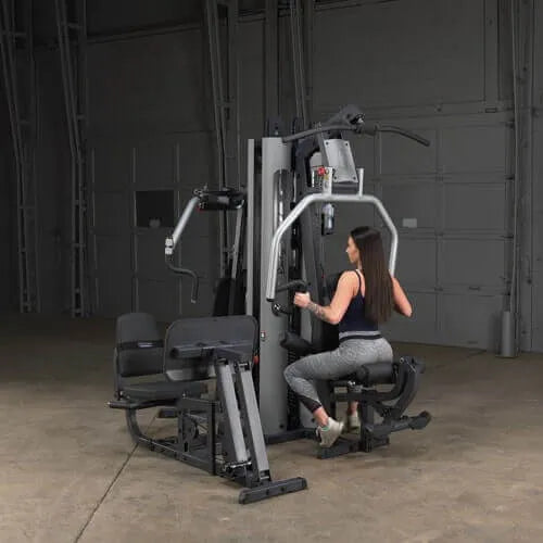 Body-Solid Multi-Stack Home Gym System G9S - woman sitting with Should workout