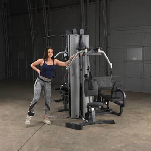 Body-Solid Multi-Stack Home Gym System G9S - woman doing leg exercise