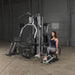 Body-Solid Multi-Stack Home Gym System G9S - woman in tank top sitting on the machine