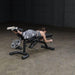 Body-Solid Olympic Leverage Exercise Bench with Leg Developer FID46 - Woman laying down doing leg curls