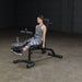 Body-Solid Olympic Leverage Exercise Bench with Leg Developer FID46 - woman working out sitting straight doing leg extension exercise 