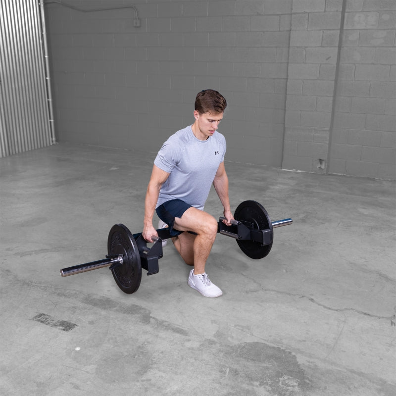 Body-Solid Open Trap Bar OTB100 - Man working out kneeling one leg while holding the barbell steel