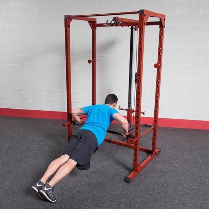 Body-Solid Power Rack Dip Attachment DR100 - man doing push ups with the actual product