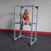 Body-Solid Power Rack Dip Attachment DR100 - Woman working out knee raise