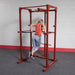 Body-Solid Power Rack Dip Attachment DR100 - woman working out in dips with the actual product