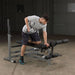 Body-Solid PowerCenter Rack Bench Combo GDIB46L - Man working out dumbbell rows