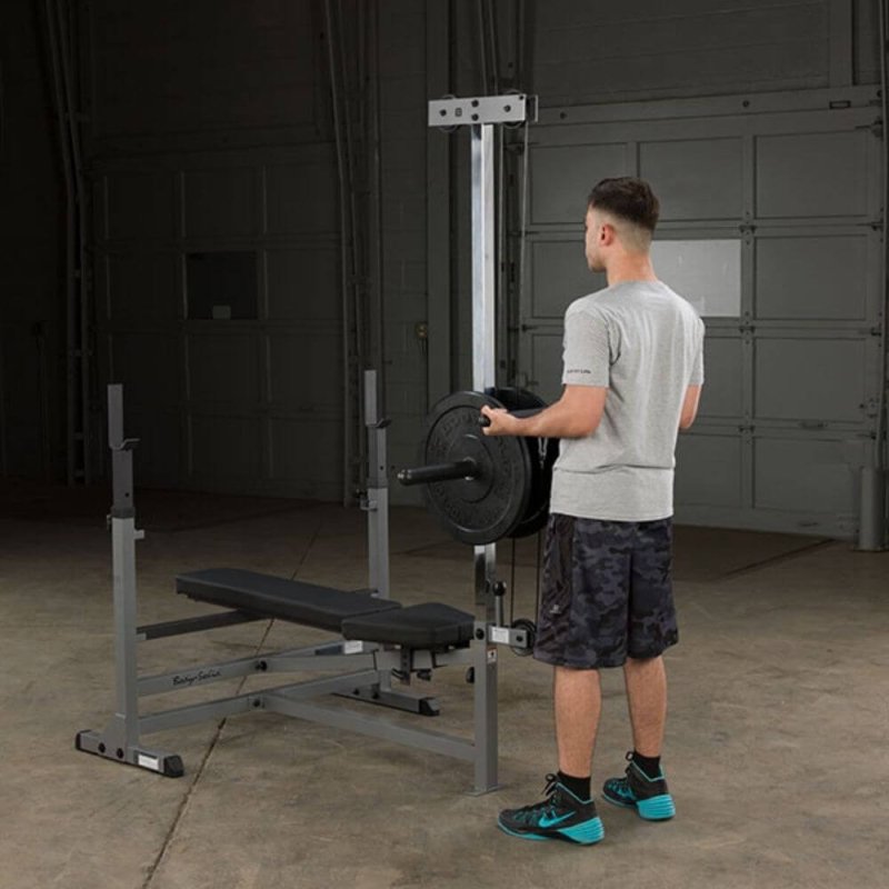 Body-Solid PowerCenter Rack Bench Combo GDIB46L - Man holding lat bars to work out