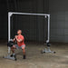 Body-Solid Powerline Cable Crossover PCCO90X - man doing squats