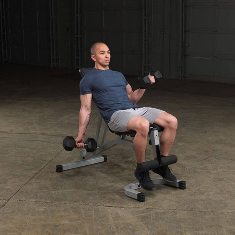 Body-Solid Powerline Flat Incline Decline Bench PFID130X - man sitting on the bench with lifting weights