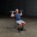 Body-Solid Powerline Flat Incline Decline Bench PFID130X - man doing shoulder press on the bench