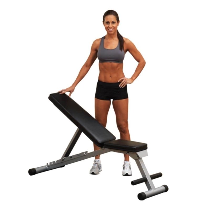 Body-Solid Powerline Folding FID Bench PFID125X - woman standing next to it