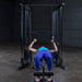 Body-Solid Powerline PFT100 Functional Trainer - woman doing bench press