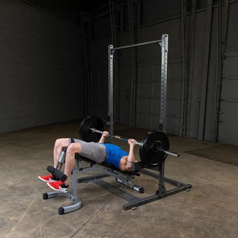 Body-Solid Powerline Half Rack PPR500 - man doing bench press next to it 