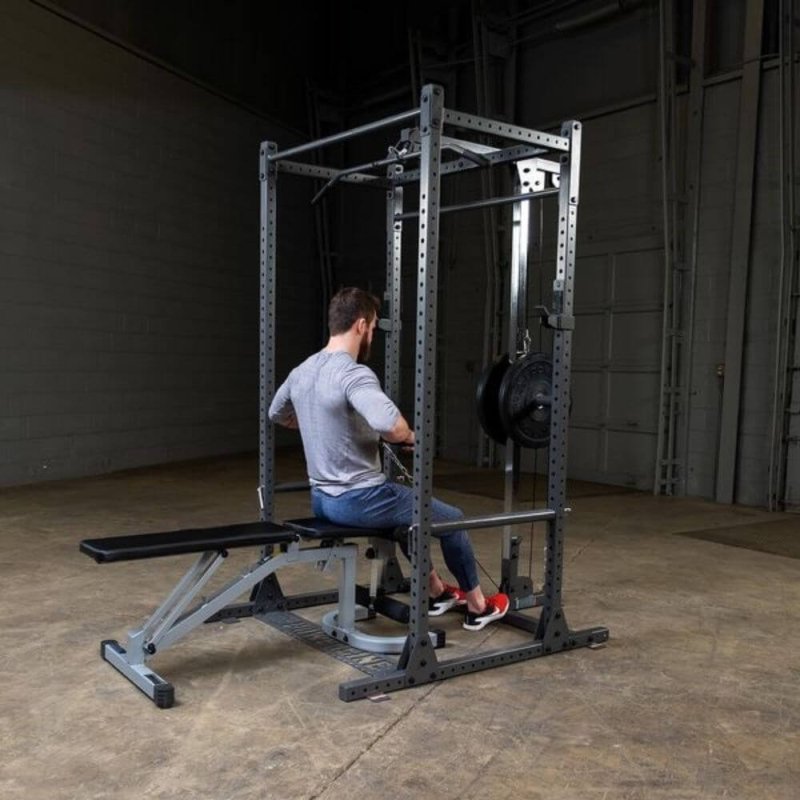 Body-Solid Powerline Lat Attachment PLA1000 - man sitting on a bench while working out