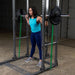 Body-Solid Powerline Power Rack PPR1000 - woman lifting weights