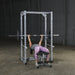 Body-Solid Powerline Power Rack PPR200X - woman doing bench press