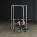 Body-Solid Powerline Power Rack PPR200X - man doing exercise on a bench