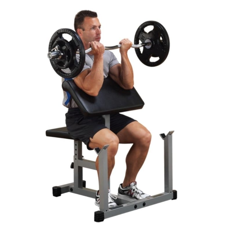 Body-Solid Powerline Preacher Curl Bench PPB32X - man lifting weight