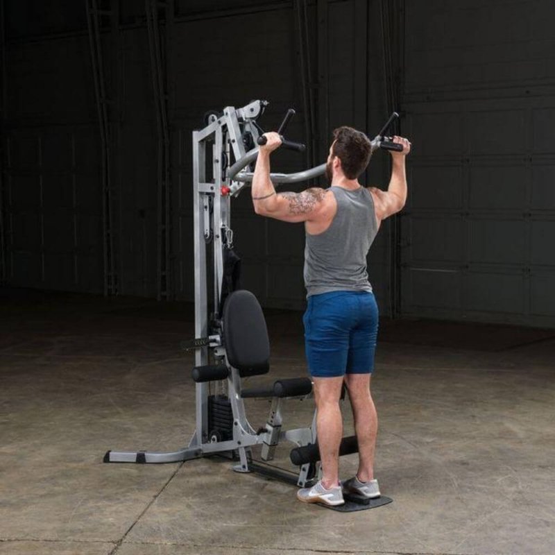 Body-Solid Powerline Single Stack Home Gym BSG10X - man doing shoulder press