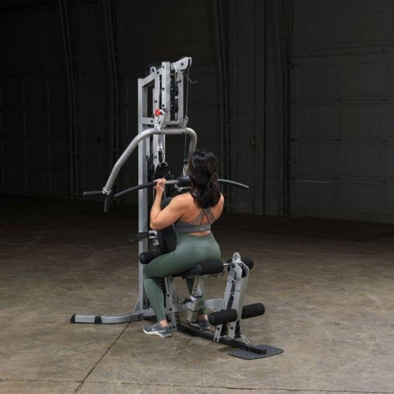 Body-Solid Powerline Single Stack Home Gym BSG10X - woman sitting on bench 