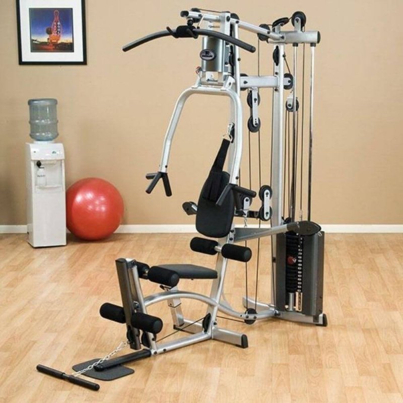 Body-Solid Powerline Single Stack Home Gym P2X - next to an exercise ball