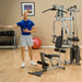 Body-Solid Powerline Single Stack Home Gym P2X - man on workout gears